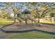 A well-maintained playground with slides and climbing features, set in a park-like environment at 2345 Lake Woodberry Cir, Brandon, FL 33510