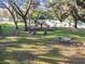 Neighborhood playground featuring slides, picnic benches, and lush landscaping for outdoor fun and relaxation at 2345 Lake Woodberry Cir, Brandon, FL 33510