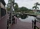 Private boat dock and walkway leading to the water at 2595 Cyprus Dr # 4-202, Palm Harbor, FL 34684