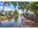 Picturesque waterfront featuring docks and canals lined with tropical vegetation and lovely homes at 2595 Cyprus Dr # 4-202, Palm Harbor, FL 34684