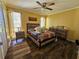 Bright bedroom with wood-look floors and a stylish bed at 3141 Ludlow Dr, New Port Richey, FL 34655