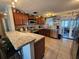 Kitchen with wood cabinets, granite countertops, and stainless steel appliances at 3141 Ludlow Dr, New Port Richey, FL 34655
