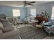 Light and airy living room with a seating area and a large window at 3141 Ludlow Dr, New Port Richey, FL 34655
