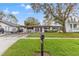 White brick house with a carport and a neatly landscaped yard at 4434 W Wyoming Ave, Tampa, FL 33616