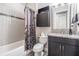 Bathroom with granite vanity, shower, and gray accents at 4492 Tuner Bnd, Land O Lakes, FL 34638