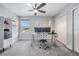 Home office with built-in shelving and plenty of natural light at 4492 Tuner Bnd, Land O Lakes, FL 34638