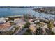 An aerial view of a waterfront home with lush landscaping and a large yard at 485 41St Ave, St Pete Beach, FL 33706