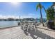 Outdoor deck with table and chairs, water views at 485 41St Ave, St Pete Beach, FL 33706