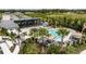 Resort-style pool with lounge chairs, umbrellas, and a covered seating area at 5216 124Th E Ave, Parrish, FL 34219