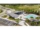 Aerial view of community pool, cabana, and surrounding landscape at 5216 124Th E Ave, Parrish, FL 34219