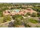 Elevated view of a community clubhouse with pool and parking at 5641 Sunset Falls Dr, Apollo Beach, FL 33572