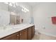 Modern bathroom with double vanity, shower, and tiled floors at 5641 Sunset Falls Dr, Apollo Beach, FL 33572