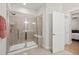 Spacious shower with glass door, tiled walls, and built-in bench at 5641 Sunset Falls Dr, Apollo Beach, FL 33572