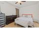 Cozy bedroom with wooden floors, dresser, and a comfortable bed at 5641 Sunset Falls Dr, Apollo Beach, FL 33572