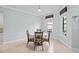 Dining area with round table and chairs, and windows at 5641 Sunset Falls Dr, Apollo Beach, FL 33572