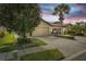 Front exterior of a home with a two-car garage and landscaping at 5641 Sunset Falls Dr, Apollo Beach, FL 33572