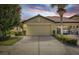 Charming home with two-car garage and landscaped front yard at 5641 Sunset Falls Dr, Apollo Beach, FL 33572
