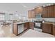 Bright kitchen featuring stainless steel appliances, ample counter space, and wood cabinetry at 5641 Sunset Falls Dr, Apollo Beach, FL 33572
