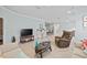 Inviting living area with a sofa, recliner, and a coffee table at 5641 Sunset Falls Dr, Apollo Beach, FL 33572
