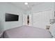 The main bedroom has a comfortable bed, a closet, and access to a bathroom at 5641 Sunset Falls Dr, Apollo Beach, FL 33572