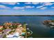 Aerial view of a waterfront home with a private pool and dock at 825 116Th Ave, Treasure Island, FL 33706