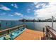 Wooden dock with kayak and waterfront views at 825 116Th Ave, Treasure Island, FL 33706