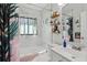 Clean bathroom with marble tile, walk-in shower, and stylish storage shelves at 946 23Rd S Ave, St Petersburg, FL 33705