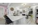 Open concept kitchen with white cabinets, quartz countertops, and breakfast bar at 946 23Rd S Ave, St Petersburg, FL 33705