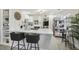 Modern white kitchen with breakfast bar and island, stainless steel appliances at 946 23Rd S Ave, St Petersburg, FL 33705