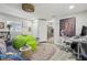 Bright and airy living room with a workspace, comfy seating, and large artwork at 946 23Rd S Ave, St Petersburg, FL 33705