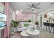 Bright living room with white sofa, pink accents, and ceiling fan at 946 23Rd S Ave, St Petersburg, FL 33705