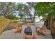 Landscaped backyard with fire pit and seating area at 1161 Howard St, Clearwater, FL 33756