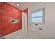 Clean bathroom with red tile shower and white bathtub at 1161 Howard St, Clearwater, FL 33756