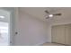 Bright bedroom with ceiling fan, large closet, and light flooring at 1161 Howard St, Clearwater, FL 33756