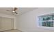 Well-lit bedroom featuring a ceiling fan and large window at 1161 Howard St, Clearwater, FL 33756