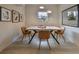 Light and airy dining area with a modern wooden table and four chairs at 1161 Howard St, Clearwater, FL 33756