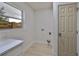 Bright laundry room with white cabinets and vinyl flooring at 1161 Howard St, Clearwater, FL 33756
