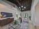 Living room with vaulted ceiling, hardwood floors, and a mix of modern and cozy furnishings at 1161 Howard St, Clearwater, FL 33756