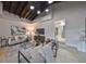 Spacious living area featuring a vaulted ceiling, hardwood floors and comfortable seating at 1161 Howard St, Clearwater, FL 33756