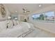 Bright bedroom with large window, queen bed and light wood floors at 1161 Howard St, Clearwater, FL 33756