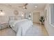 Spacious main bedroom with light walls, a ceiling fan and large window at 1161 Howard St, Clearwater, FL 33756