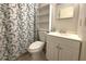 Bathroom with a shower/tub, toilet and vanity at 12663 Eddington Rd, Spring Hill, FL 34609