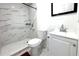 Modern bathroom with a large shower and marble tile at 12663 Eddington Rd, Spring Hill, FL 34609