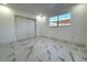 Bright bedroom with tile floors and large window at 12663 Eddington Rd, Spring Hill, FL 34609