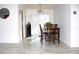 Bright dining room with tile floors and wooden dining set at 12663 Eddington Rd, Spring Hill, FL 34609