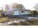 Ranch-style house with attached garage and a well-maintained lawn at 12663 Eddington Rd, Spring Hill, FL 34609