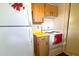 Kitchen with white appliances and wood cabinets at 12663 Eddington Rd, Spring Hill, FL 34609