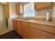 Kitchen with wood cabinets and double sink at 12663 Eddington Rd, Spring Hill, FL 34609