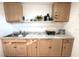 Clean kitchen featuring light wood cabinets and a marble countertop at 12663 Eddington Rd, Spring Hill, FL 34609