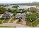 Aerial view of waterfront home with pool and lush landscaping at 140 Brightwaters Ne Blvd, St Petersburg, FL 33704
